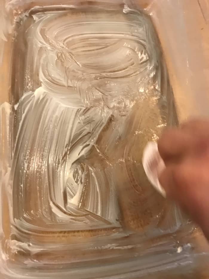 Butter a casserole dish. This is easiest by using a bit of the wrapper that the butter comes in as a handle. Preheat the oven to 350°F.