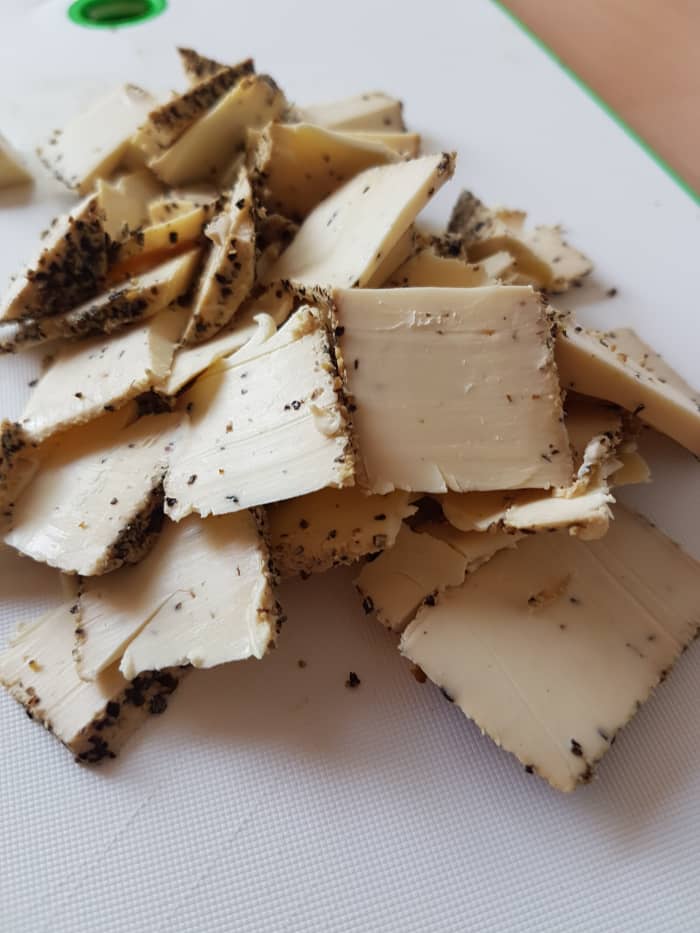 Chop the pepper cheese into small bits so it is easier for it to melt into the pepper cheese sauce.