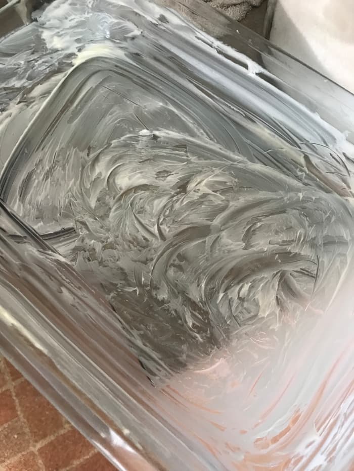 Start by generously buttering a 9x13 casserole dish. This adds another layer of flavor to the finished dish, and helps with easy cleanup by keeping the dish from sticking.
