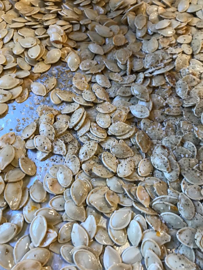 Roast the seeds for about 30 minutes at 400F. Stir them every ten minutes or so. Stirring the seeds exposed more of the surface to the heat, ensuring the seeds are crunchy on both sides.