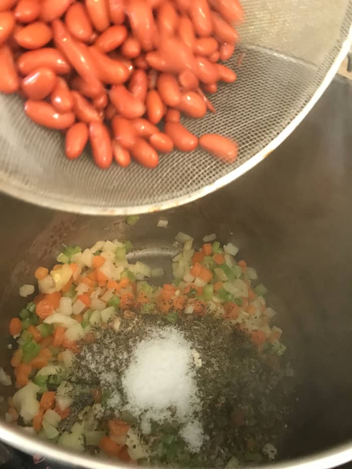 You can't have minestrone without beans, and in this case red kidney beans are perfect. You can cook them from dried, or use canned. If you use canned make sure you drain the liquid and rinse them well.