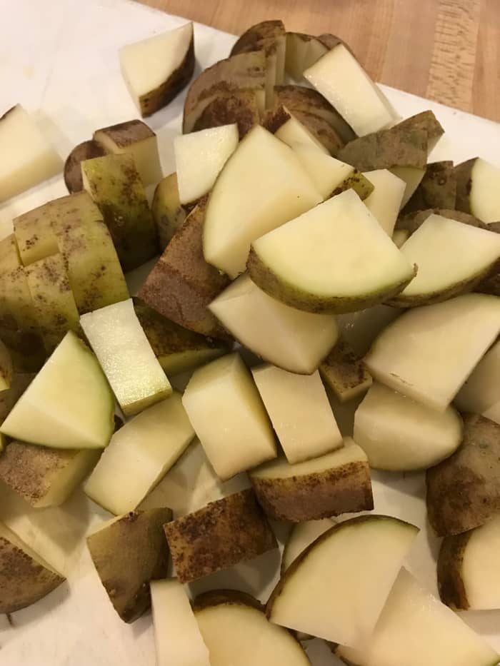 Use your favorite potato - I always have Russets, so I use those. I like how they become tender and soft, and help to thicken the stew. But a Yukon gold or new potato would be nice too. Just keep them about the same size as the beef cubes.