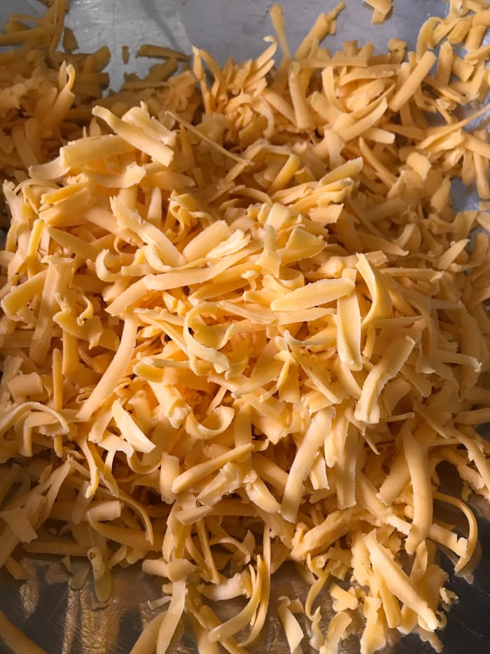 Extra sharp cheddar cheese is the go-to for this recipe. The strong flavor balances perfectly against the beef and vegetables in this dish. Grate it yourself to save money, or grab the package of already grated cheese to save time!