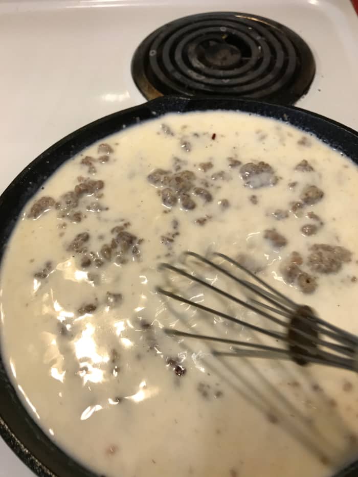 Watch the sausage gravy as it gets to the boiling point. You need to let it simmer for at least a minute to cook off the raw flour taste and to get it to thicken correctly, but boiling can 'break' it, leading to a greasy gravy.