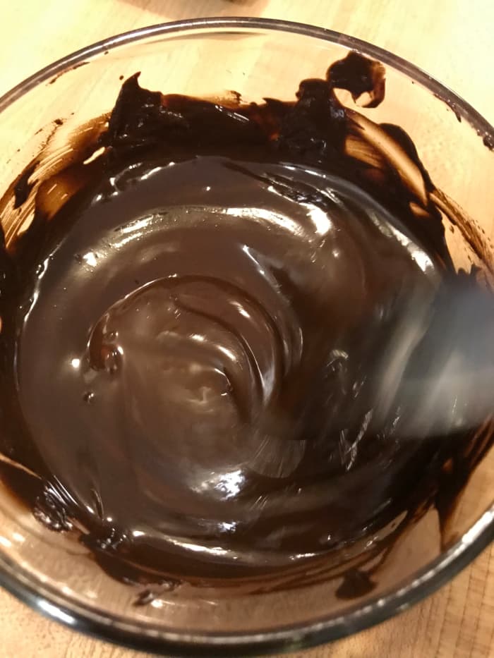 Melting the unsweetened chocolate and creaming it into the butter and sugar is one trick to success for this easy chocolate fudge cake.