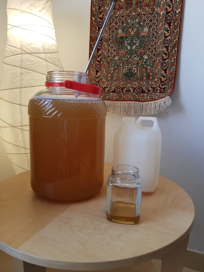 Add honey to water, mix well. Leave a decent amount of headroom; otherwise, your mixture will overflow.