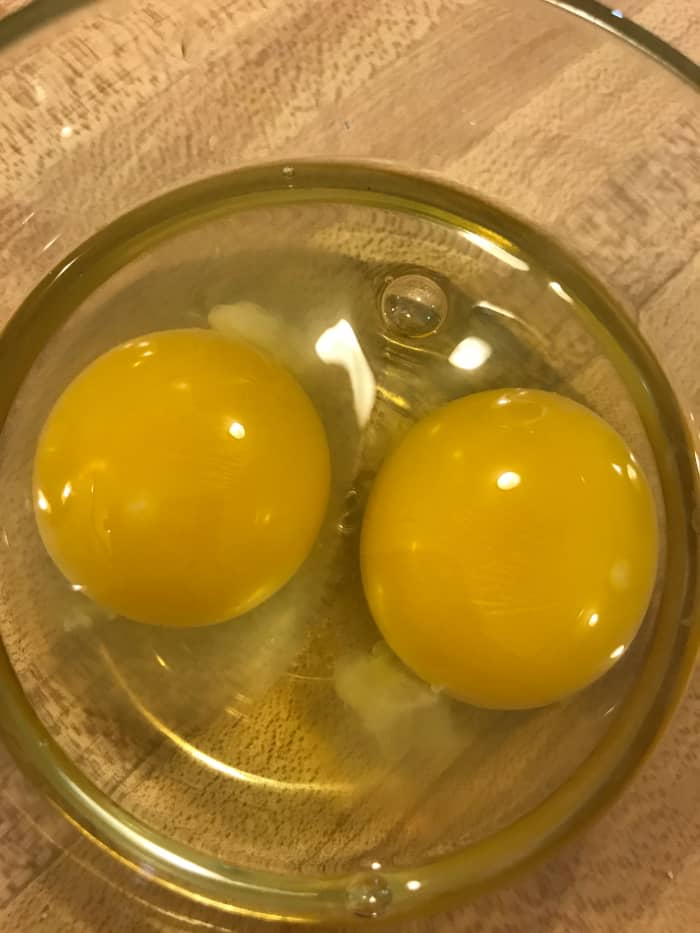 It's easier to check for shell fragments and broken yolks if you crack eggs into a small bowl prior to cooking.