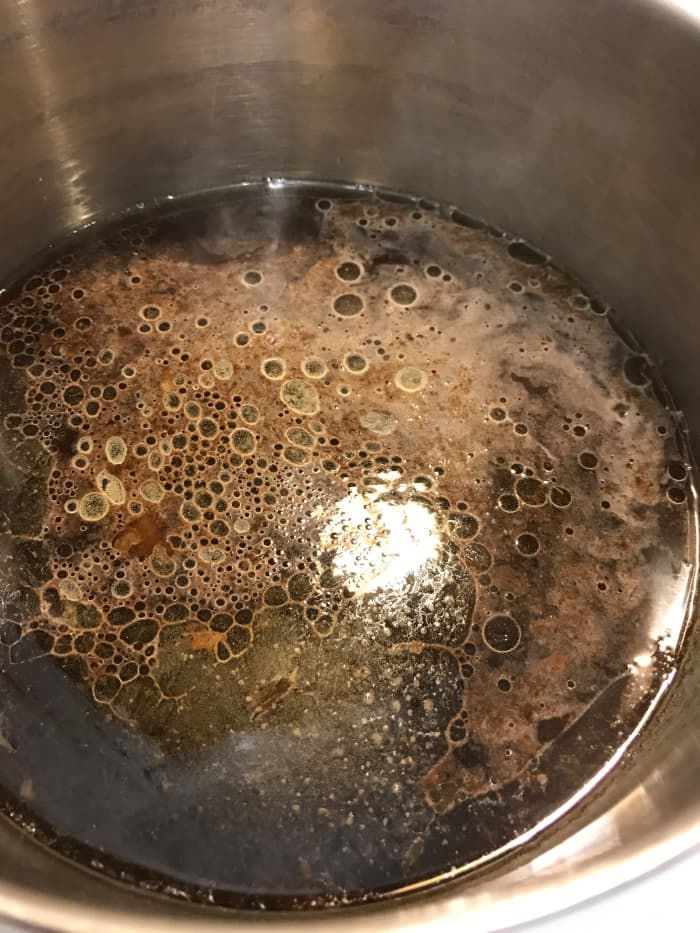 Making jus is simple. Skim off the fat, then bring it to a simmer in a small saucepan. Add a little red wine or a shot of lemon juice or vinegar and it's good to go. The acid is a perfect counter for the richness here.