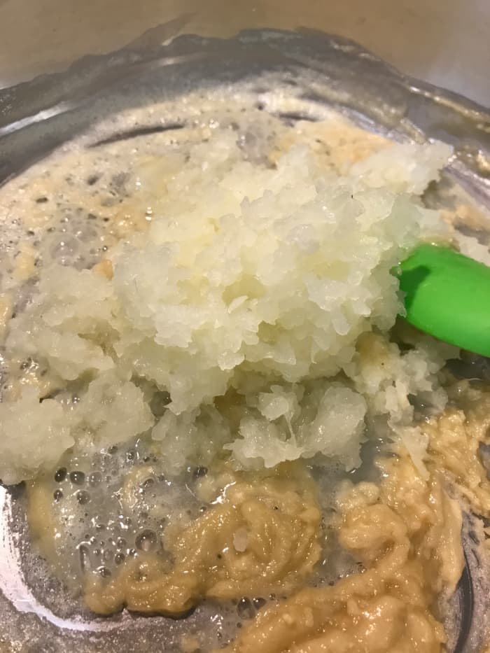 If you use onion, add it to the butter/flour mixture before you add the milk. Just dump it in, and stir well.