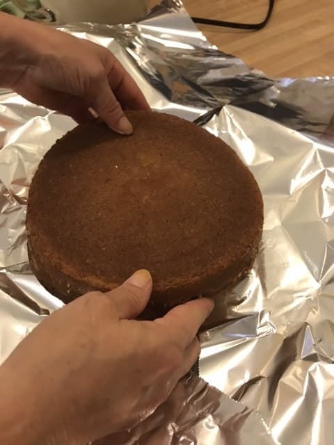 Transfer one of the cakes to the plate, making sure it's centered on top of dollop of frosting. Top just the top with lemon buttercream, and add the second filled cake.