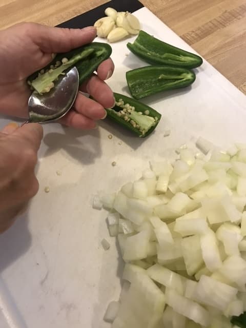 You can control the heat of jalapeno peppers by removing the seeds and white membranes, where the capsaicin is stored. Be careful not to touch your eyes!