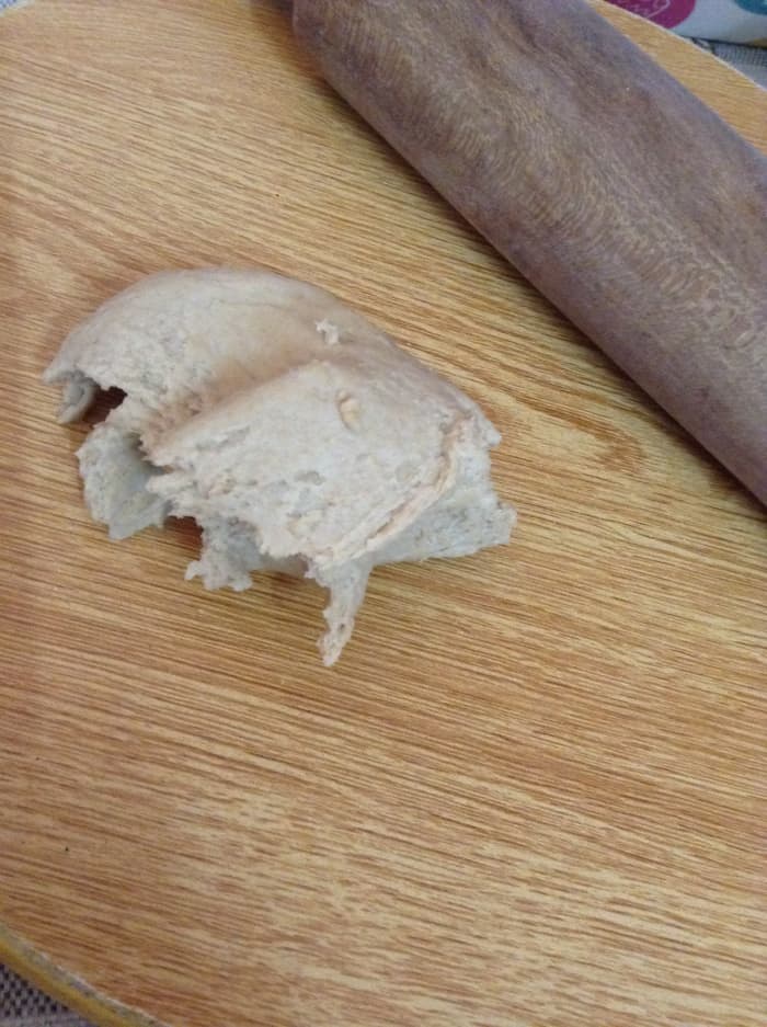 Divide the dough in 13 separate pieces. If you want a Chapati of shorter diameters, you can divide the dough into more pieces.