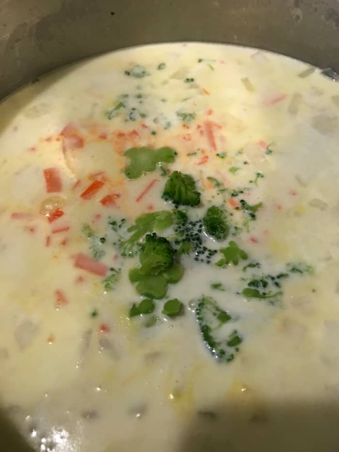 Add the carrots and broccoli to the soup pot and stir. Keep the pot at a bare simmer for just at 20-25 minutes, or until the vegetables are soft and cooked through, but still have some body.