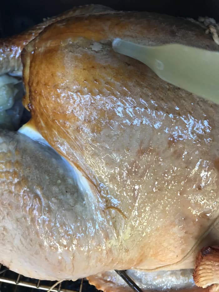 Baste with the honey/vinegar/broth mixture about every hour. Don't worry too much about the timing - just give it a go every once in a while until the liquid is gone. I think this one took about four times to use up the basting liquid.
