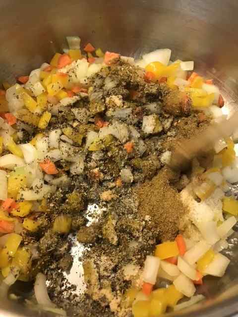 Once the vegetables have softened, toss in the spices and cook for about two minutes. This simply helps wake the spices up a bit and intensifies their flavors.