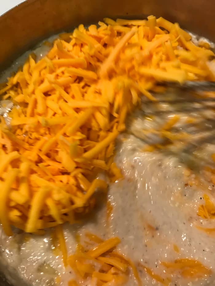 The best choice for this dish is cheddar, and preferably a sharp cheddar. We even go for extra sharp when we can find it - it's the perfect balance against the bacon and onion.