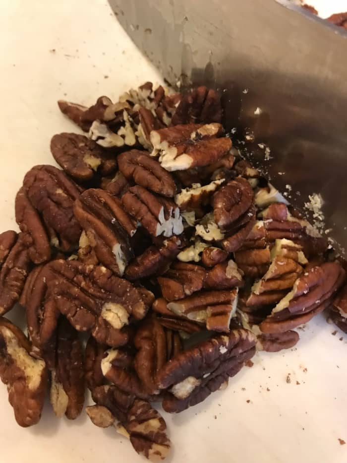 I buy pecans in bulk, so I almost always have whole pecans. If you buy them at the grocery store, you can probably get pecan pieces for less, saving a bit of money.