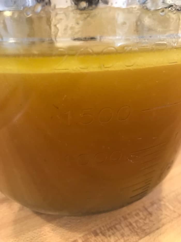 You'll notice that the fat will rise to the top - that's fine. Stick the broth into the fridge and let it chill completely. This will make removing the fat super easy.