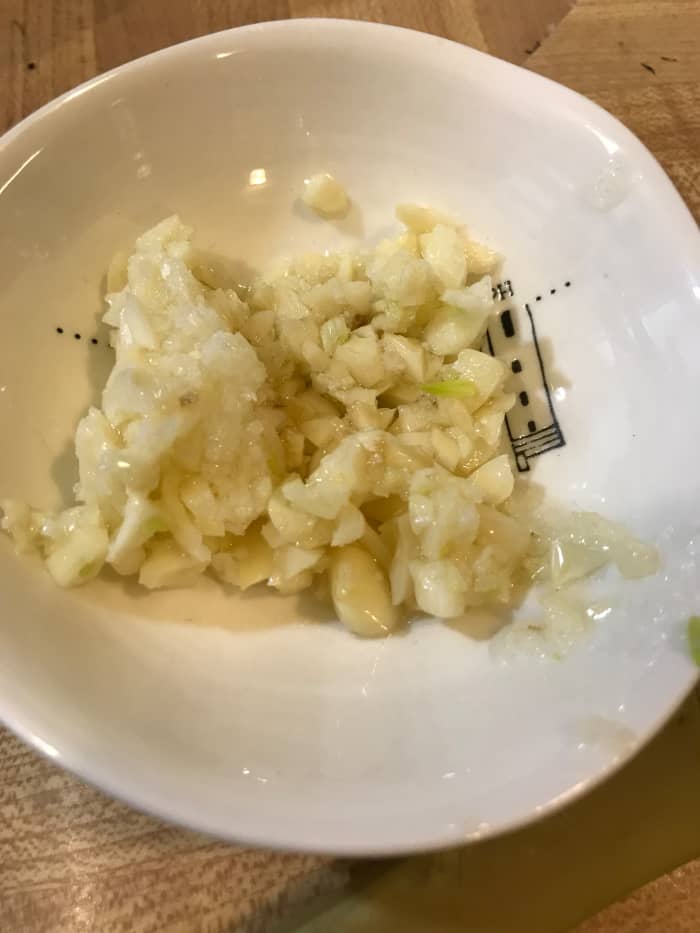 We love garlic and this dish simmers for long enough to ensure the garlic is mellow, so I use a lot. I think the recipe calls for 4 clove, but I think I actually use more like 6. Use as much - or as little - as you like!