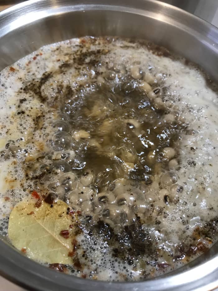 A nice gentle simmer is all the black eyed peas need. I stick mine on the back of the stove and just let them go on their own while I do something else.