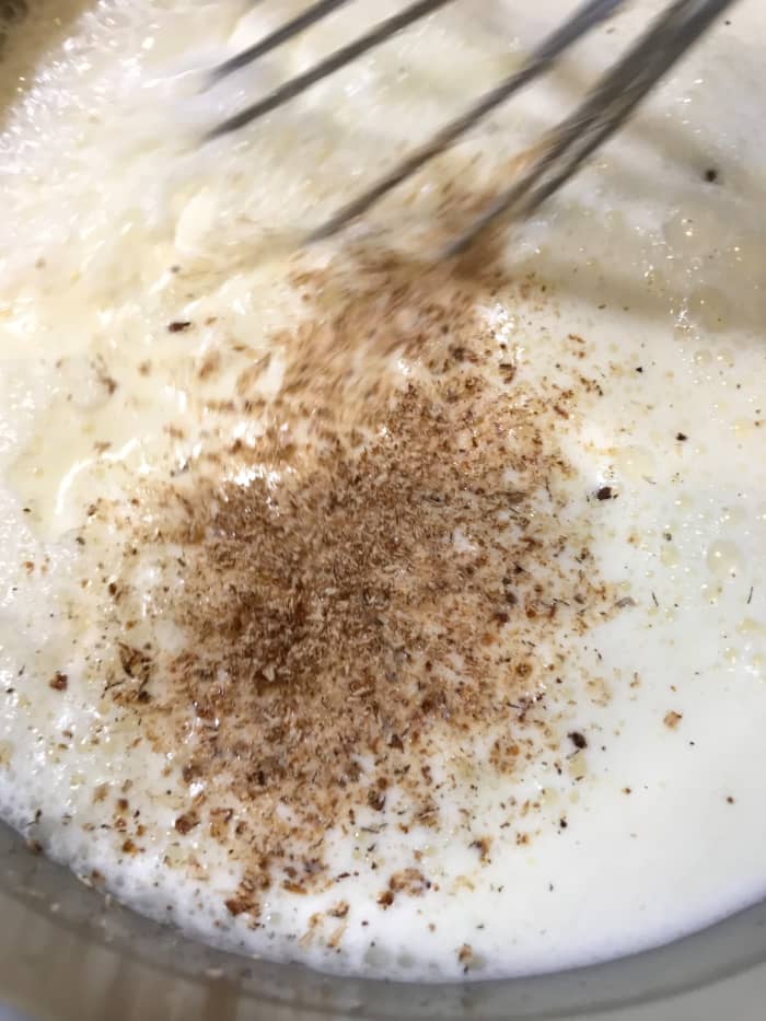 Add a pinch of salt and the fresh nutmeg. If you'd like you can add 1/2 teaspoon of cinnamon, or a shot of vanilla once it's off the heat, but we really like the simplicity of just nutmeg.