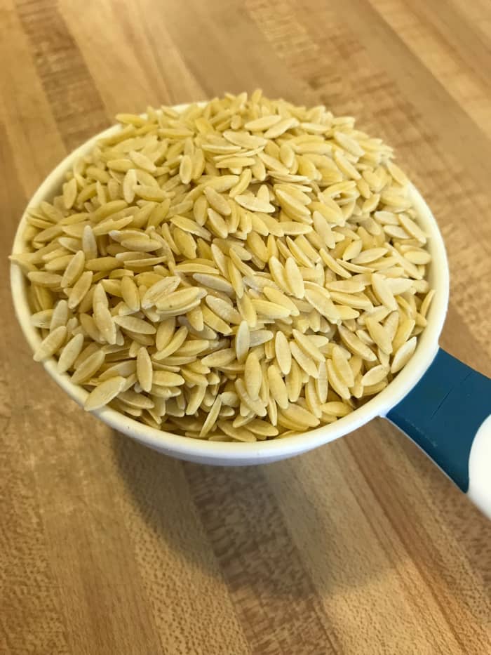 I buy orzo in the bulk section of the supermarket, although you can also find it in boxes on the pasta aisle. I've also found it online at a good price. Alternately you can use broken angel hair pasta.