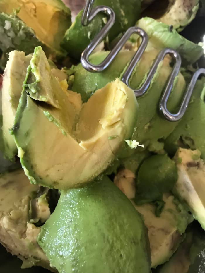 I like guacamole a little (not a lot) chunky. I use a potato masher to get the texture just right. If you want bigger chunks then mash less, or keep going for a super creamy consistency.