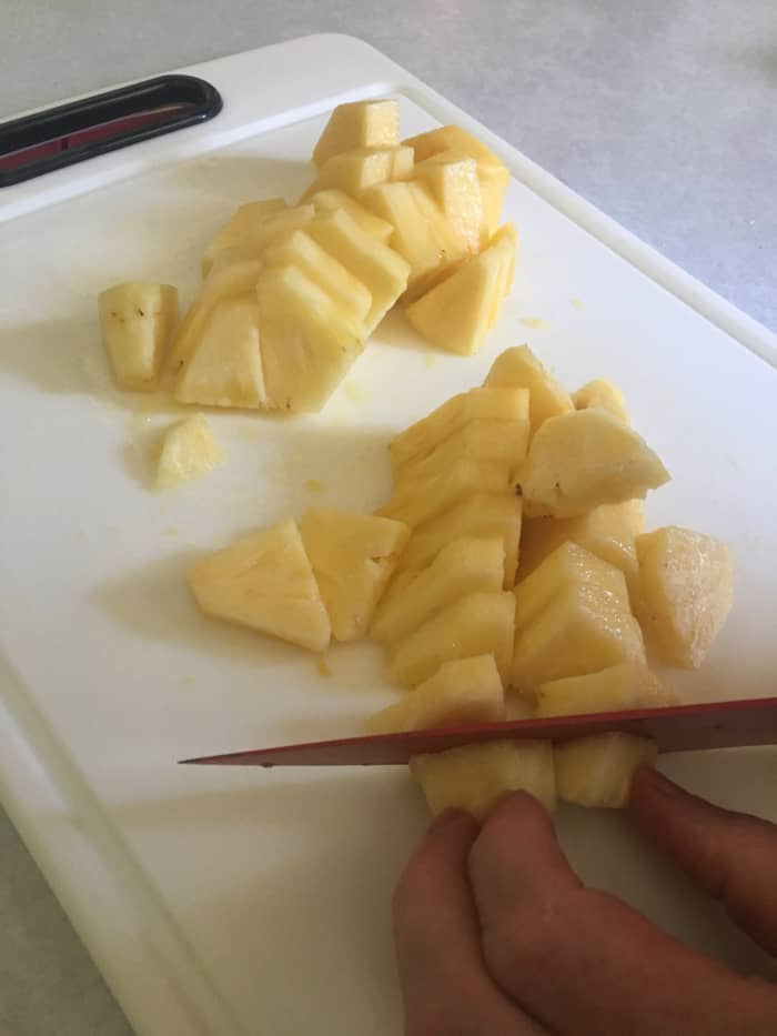 While canned pineapple tidbits would probably work in this recipe, there's nothing like freshly cut pineapple.