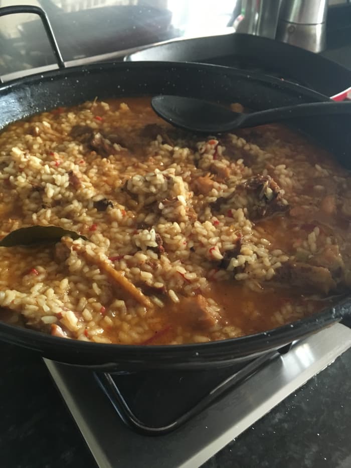 This authentic arroz con pollo recipe from Extremadura was made without colorants. It has a lovely thick broth that pools around the cooked rice.