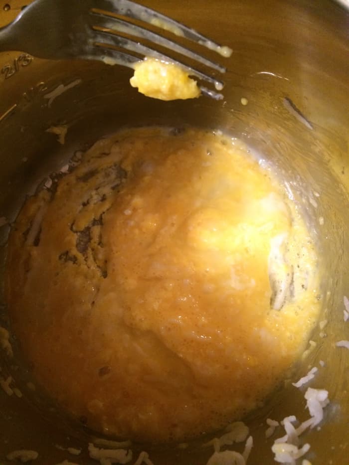 Crack the eggs into the Instant Pot and scramble. Once scrambled, add your diced onion and let that sauté a bit.