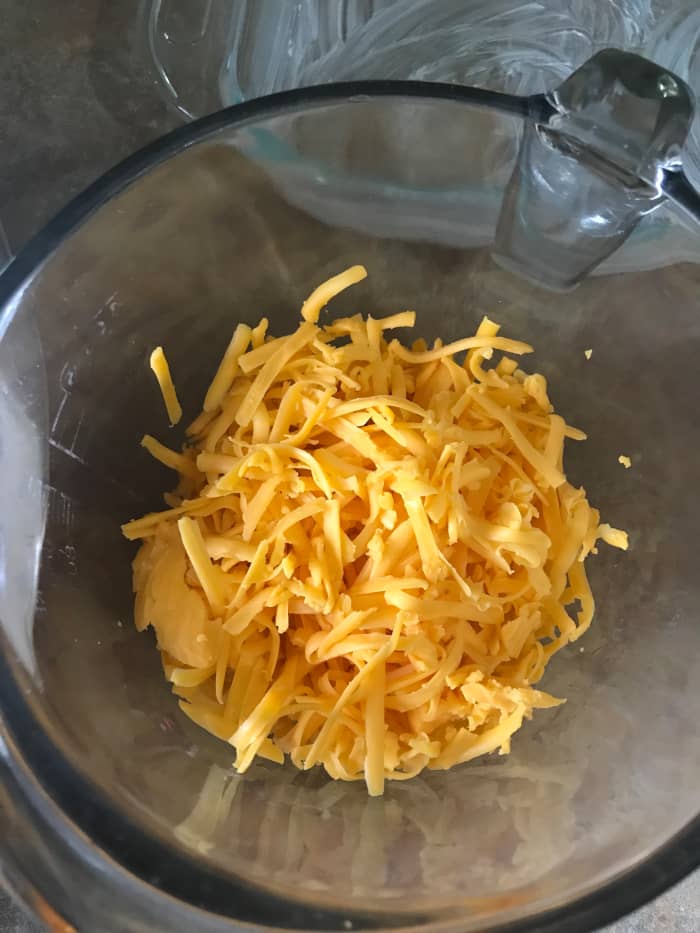 You can use whatever type of cheddar you like. I personally like the extra sharp cheddar for this dish. It's a great contrast against the sweetness of the sauce and the zing of the pineapple.