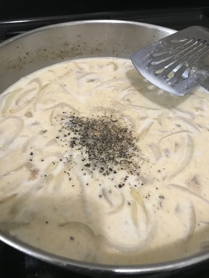 Stir in the milk, and add lots of freshly cracked black pepper. The gravy will be done once it comes all the way up to a boil and simmers for one minute. That's how you know it's as thick as it's going to get. Black pepper is perfect with the gravy.