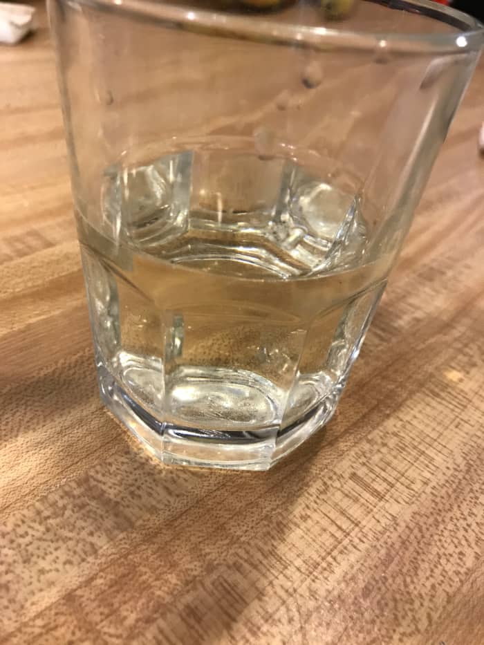 I used white wine in this article, although you can use whatever you like. Broth works well, as does apple or lemon or orange juice. This was an 8 ounce glass and I filled it half full. The measurements do NOT have to be exact - this is easy cooking!