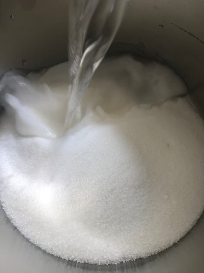 A simple syrup is just that - a mixture of sugar and water heated just enough to dissolve the sugar. Starting lemonade this way results in a perfectly sweet - but not over sweet - result.