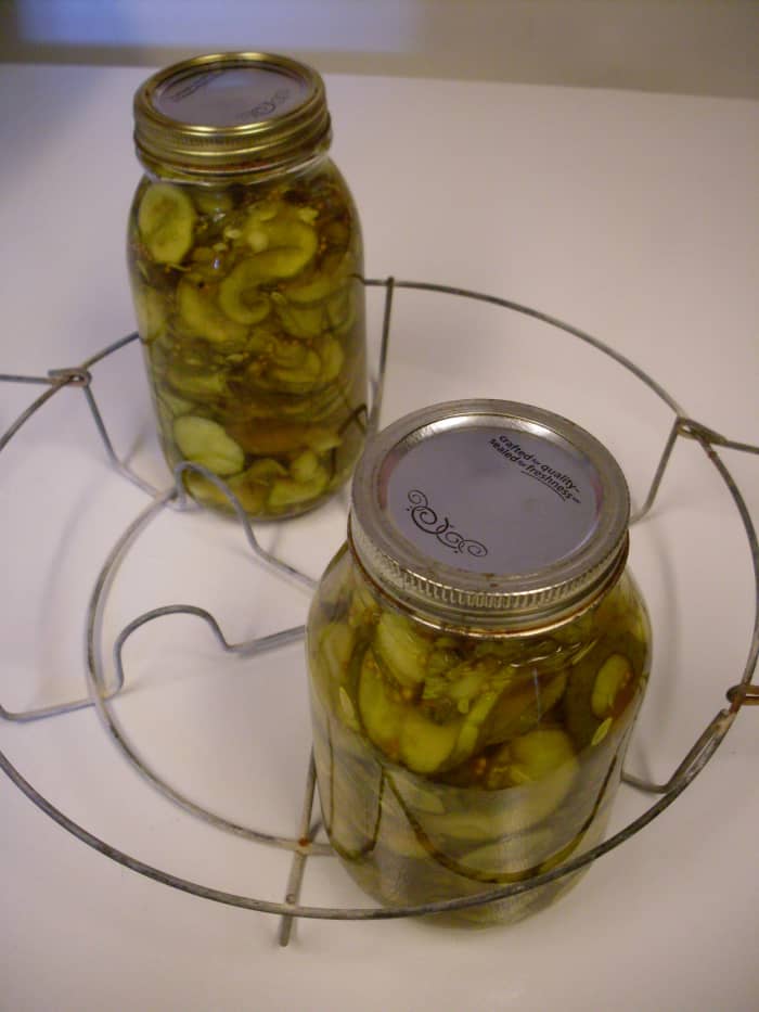 Pack cucumbers and other vegetables into jars fairly tightly. Using a funnel, if you wish, ladle on hot pickling solution, leaving 1/2-inch headspace.