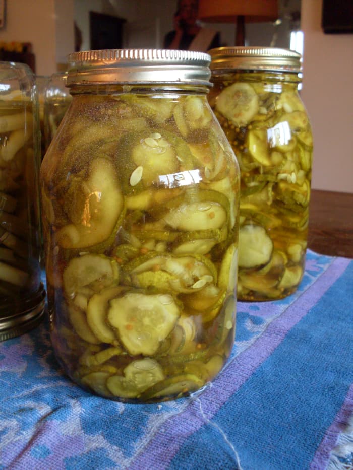 Remove each jar carefully with a jar lifter, and place on a towel away from drafts. Let sit overnight. Jars usually "pop" or "ping as lids seal.