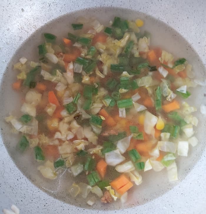Add about 1 cup of water or just to immerse the vegetables and cook on medium high flame till vegetables are cooked. Do not overcook vegetables. It should be crunchy.