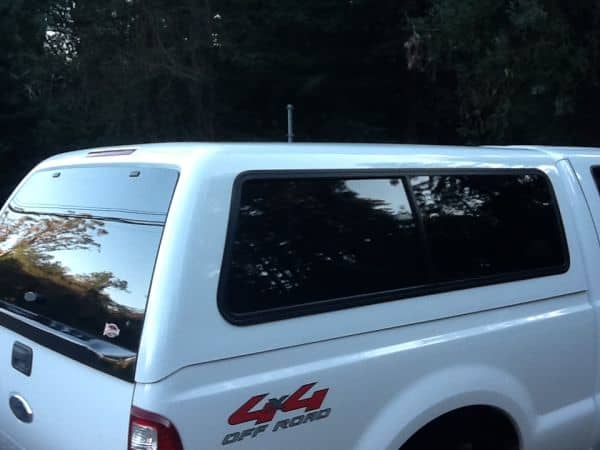 A 2008 Superduty. Notice the molded piece on the back door of the shell that covers up the step that comes out of the tailgate on this truck.