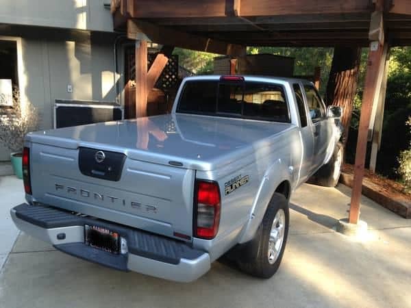 Notice how the hard tonneau cover compensates for the bulging tailgate. Trying to fit a tonneau not meant for this truck will not work.