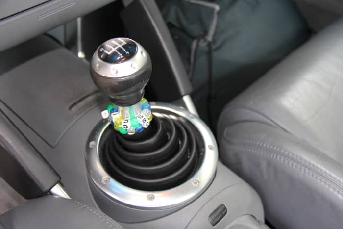 Sports car-driving is a terrible time to be lazy! If you can, row those gears to keep the engine in its peak powerband (where it can spread the load between the engine, turbo, and gearing—not just the turbo).