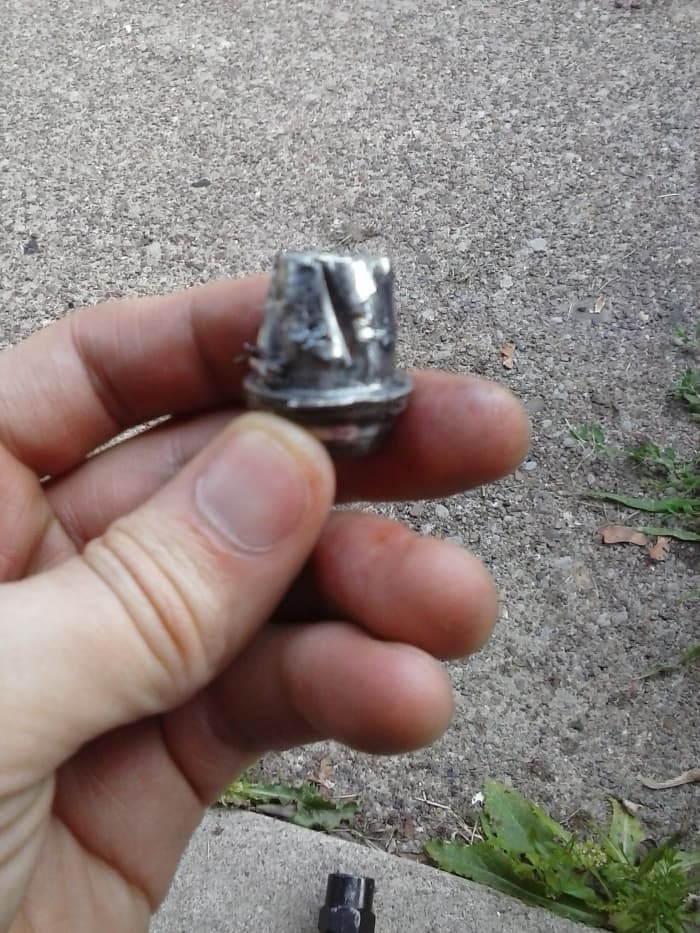 How to Remove a Stuck or Stripped Lug Nut - AxleAddict Lug Nut Won T Come Off Just Spins