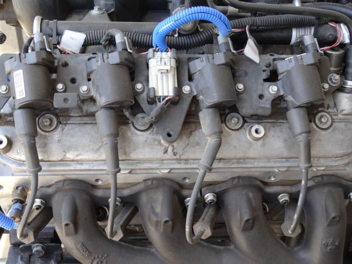 Each cylinder has it's own coil but a short spark plug wire connects to the spark plug. Chevy V8 pictured.