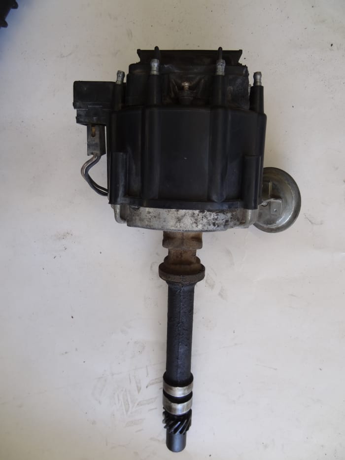 HEI distributors contained the ignition coil in the top of the distributor cap. The HEI only needed 12V to operate.