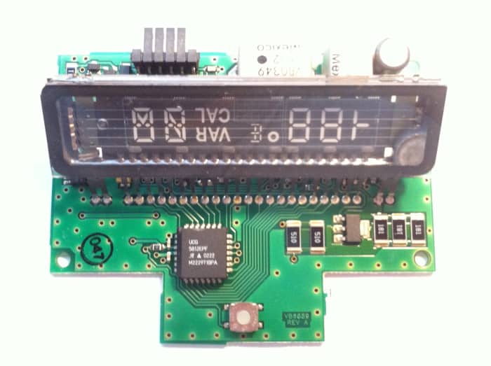 LCD Vacuum Fluorescent display manufactured in Mexico for the 2001 Ford Explorer Sportrac. Displays compass and external temperature.