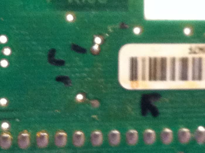 Notice that the UPC label is covering one of the solder points. I chose to leave it alone, but this could also contribute to a fault over time.
