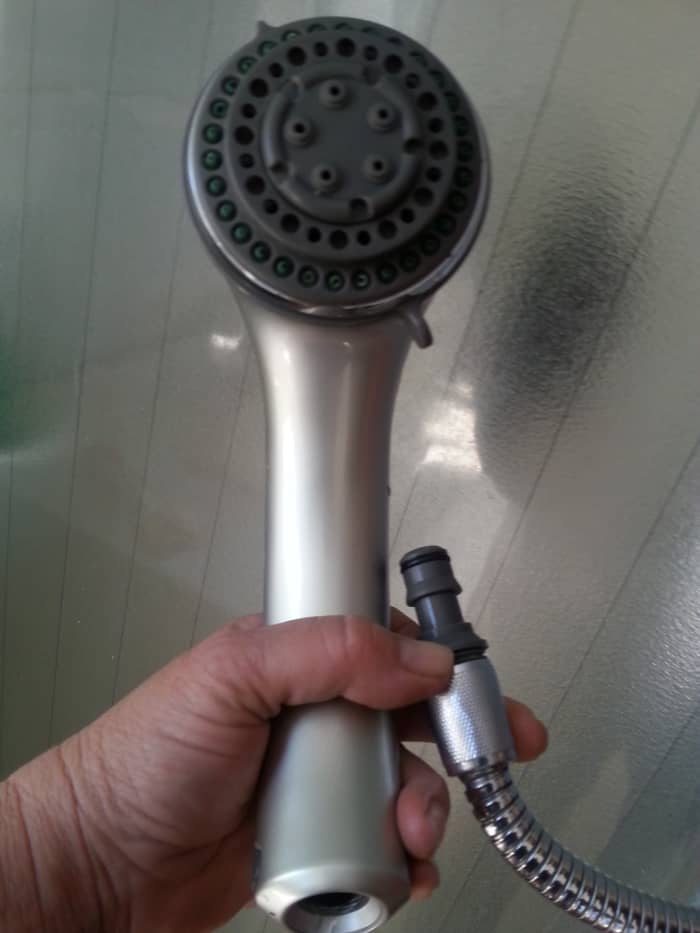 My shower head can reach outside the shower cubicle. (A common shower style that can be removed and held in your hand.) Removing the head reveals the same type of connection as my garden hose. Great for portable washing machines!