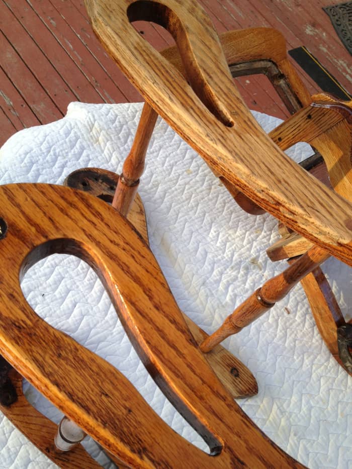 Paint stripper will easily remove the old varnish from your wood pieces and preserve the aged look of the wood, which sanding may remove.