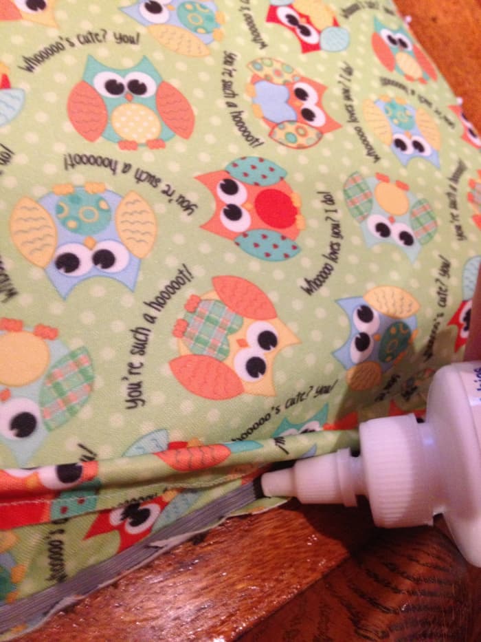 Use upholstery glue to secure the welting to the spline. While the glue sets, hold the pieces in place with pins.