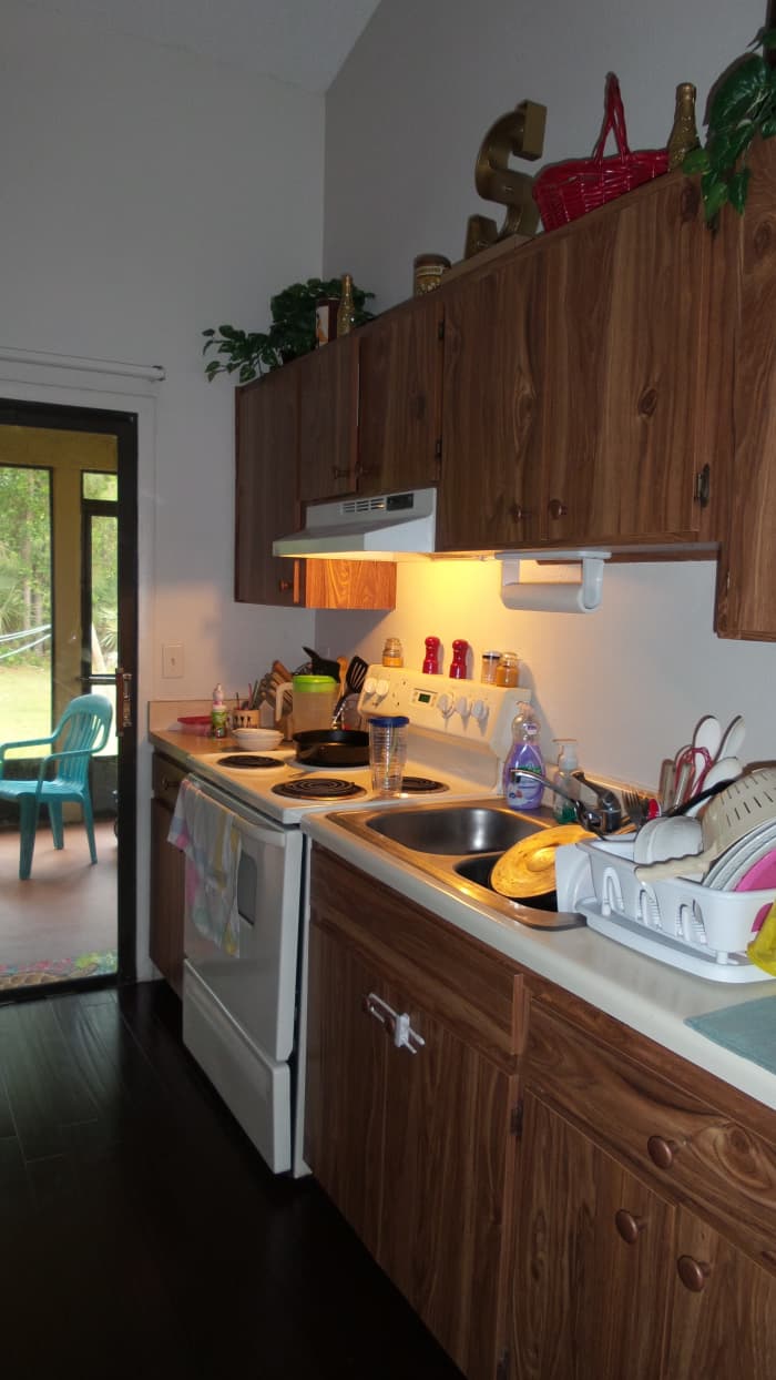 Yep, my tiny kitchen gets cluttered and messy pretty quickly! Cutting down on clutter helps to minimize this. Photo by AMB