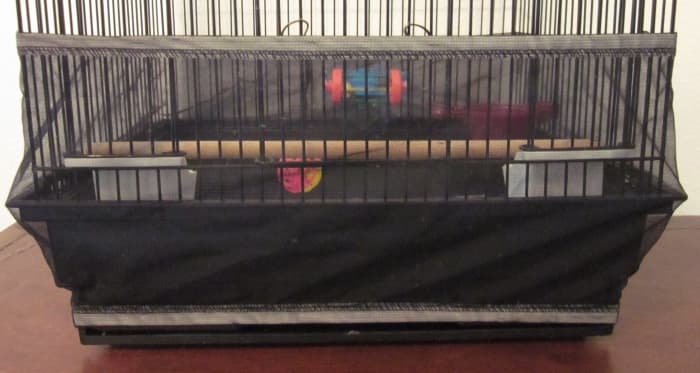 Use a cage skirt to keep your budgie's mess inside the cage.